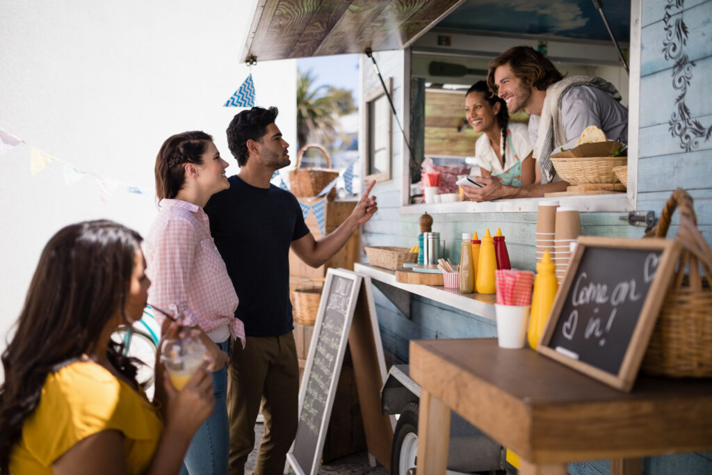 HOA hosts a community event by offering food trucks for a movie night